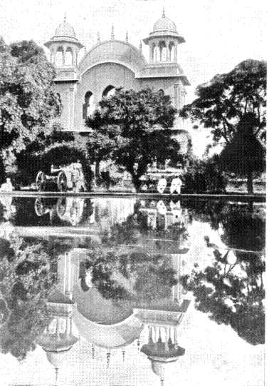 The Memorial Arch and Tank to the memory of Sir Louis Cavignari and the officers and non-commissioned officers and men of the Guides killed in the defence of the Kabul Residency, September 3, 1879. In the foreground is a brass cannon captured during the Relief of Chitral