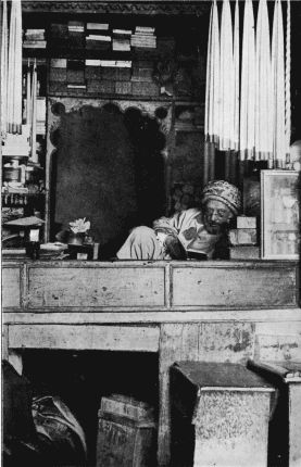 A TUNISIAN SHOPKEEPER.