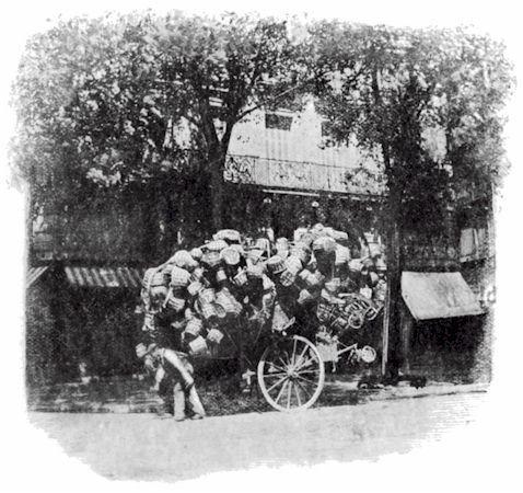 (overloaded cart of baskets)