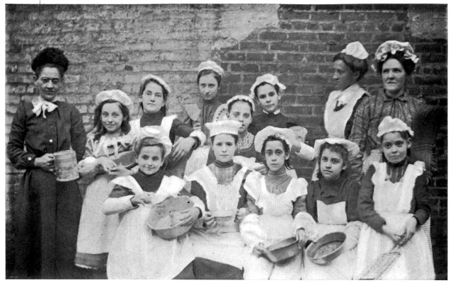 A COOKING CLASS OF MOTHERS AND CHILDREN.