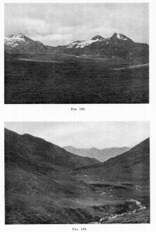 Fig. 188—Asymmetrical peaks in the Central Ranges
between Antabamba and Lambrama. The snow-filled hollows in the
photograph face away from the sun—that is, south—and have retained
snow since the glacial epoch; while the northern slopes are snow-free.
There is no true glacial ice and the continued cirque recession is due
to nivation.